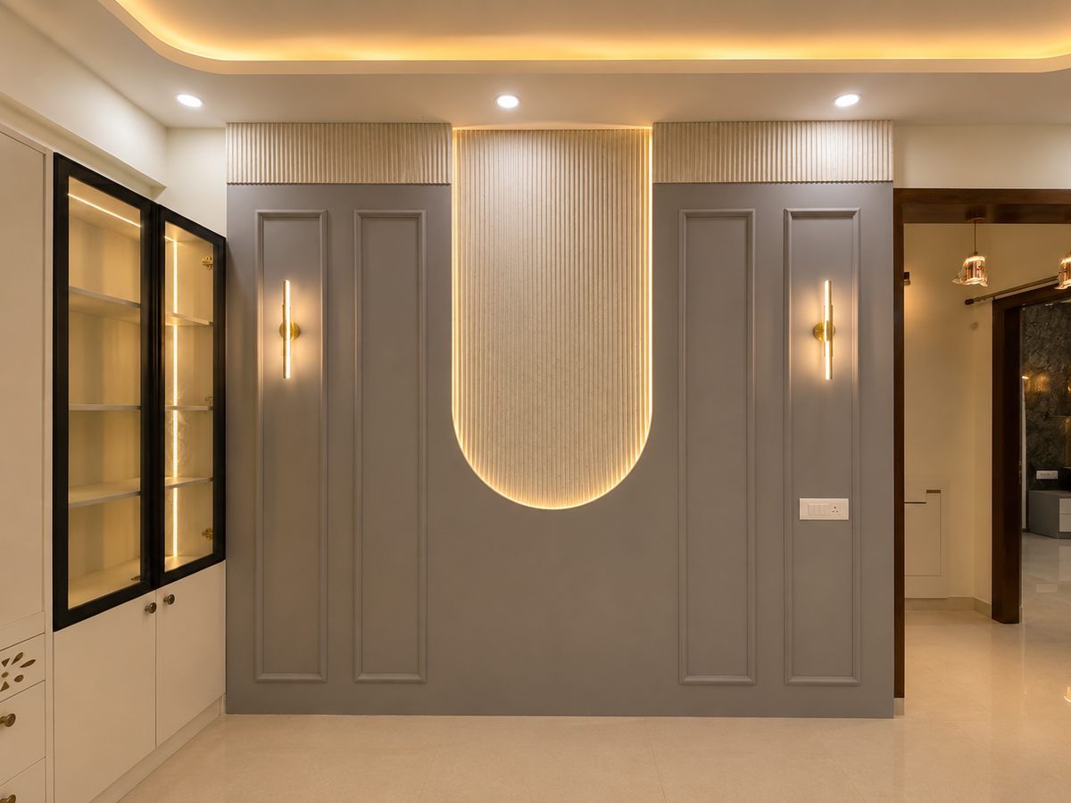 Feature wall with an arched, cove-lit panel, Bengaluru interior by LuxeMorph Studios