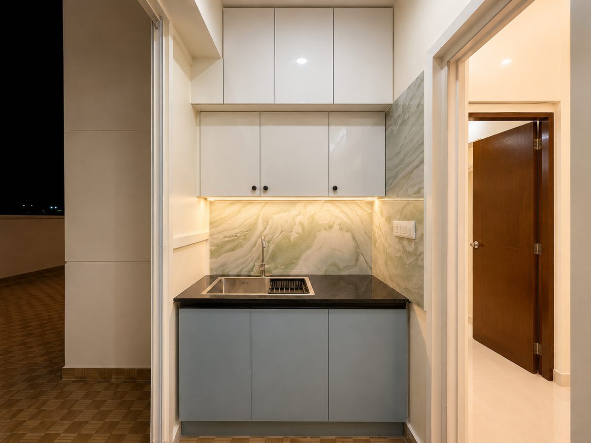 Compact kitchen with blue base units, Bengaluru interior by LuxeMorph Studios