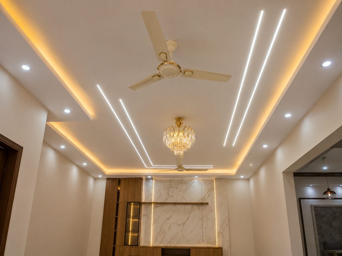Living-dining with an ornate false ceiling and chandelier, Bengaluru interior by LuxeMorph Studios